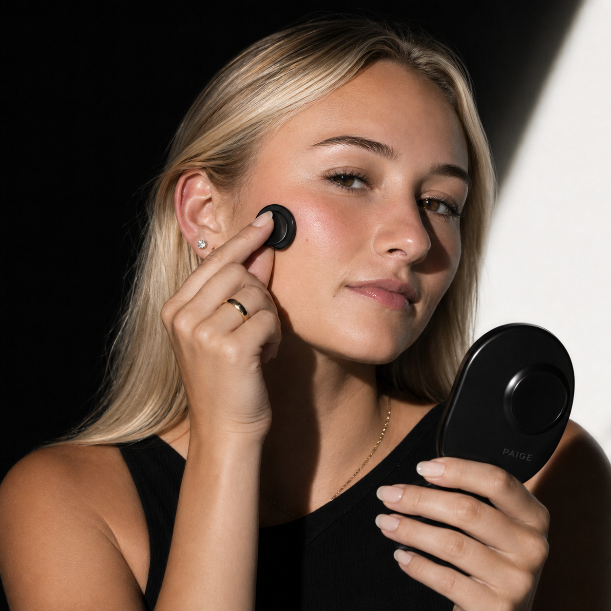 Paige model applying Jelly Veil to her cheek